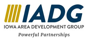 Four gold vertical bars next to ‘IADG’ in navy, with ‘Iowa Area Development Group’ in gray uppercase letters below and the tagline ‘Powerful Partnerships’ beneath.